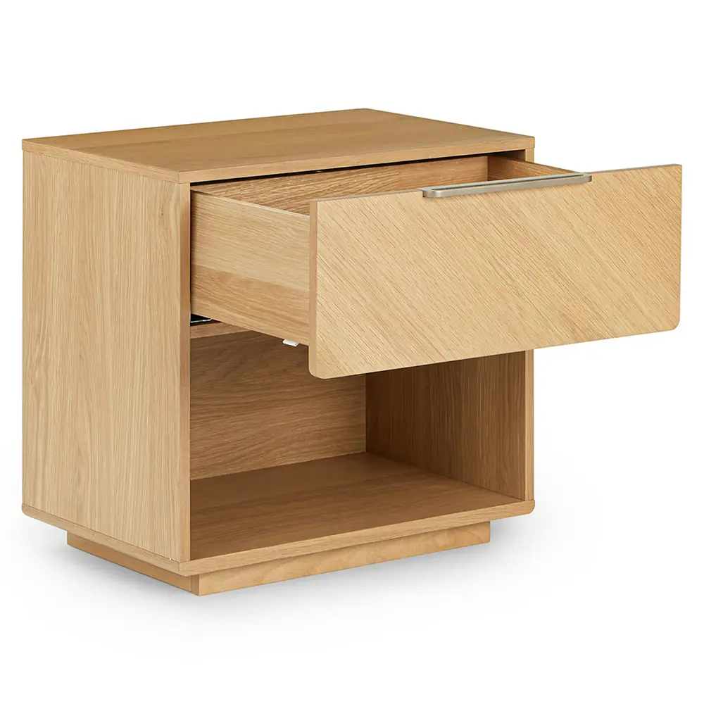 Wooden nightstand with a drawer in bedroom setting.