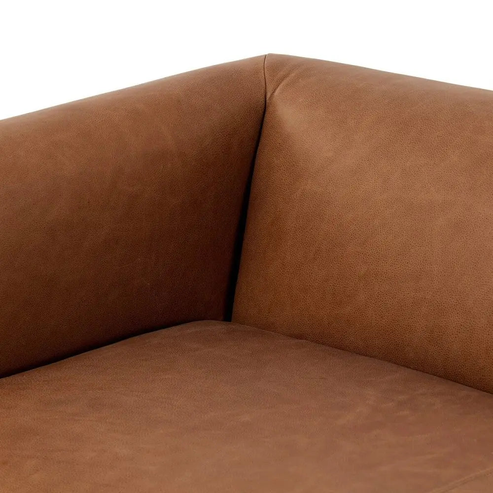 Brown leather sofa corner close-up on a white background