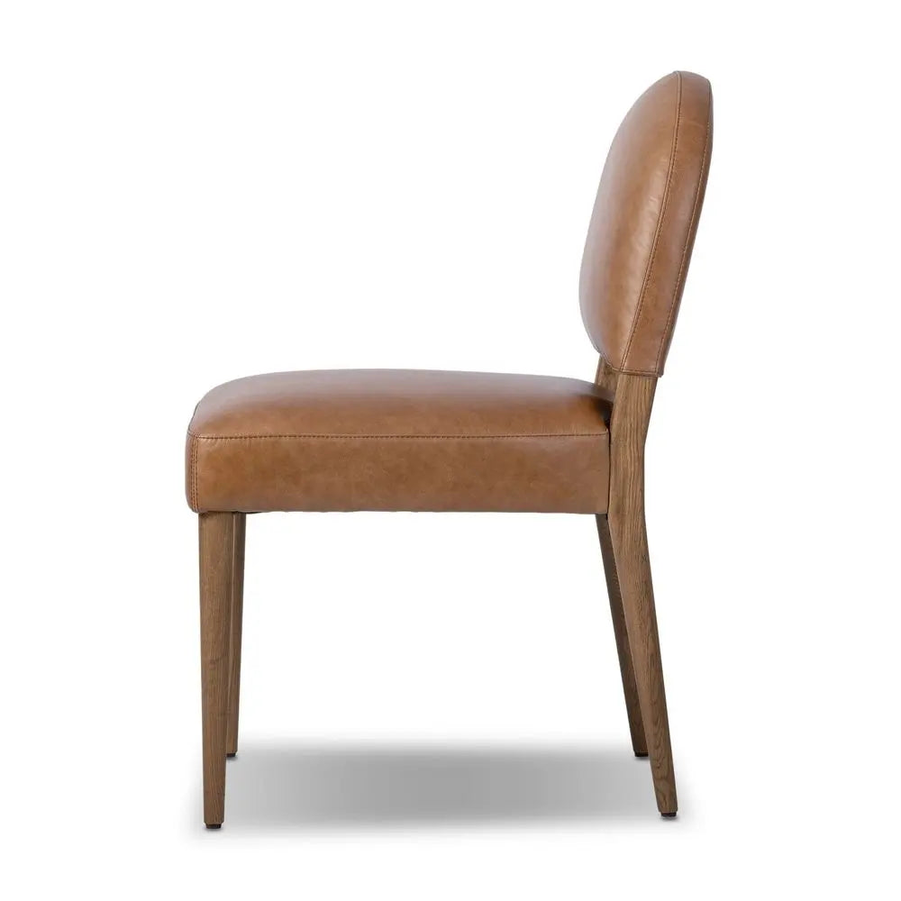 Brown leather chair with iconic style in living room.