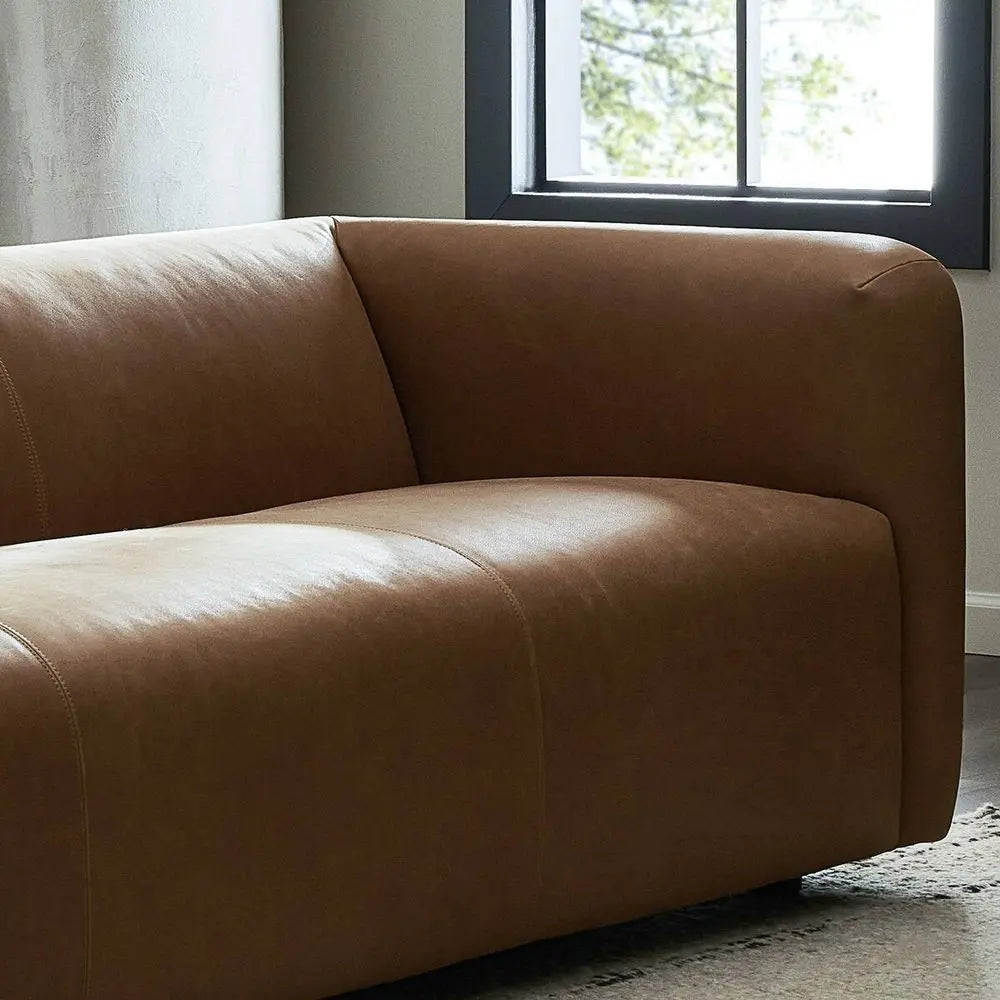 Brown leather sofa in a modern living room.