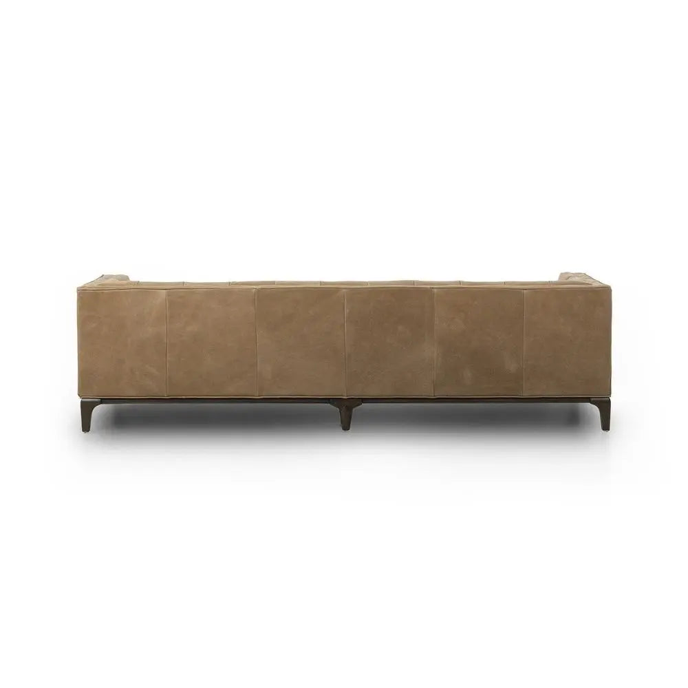 Brown leather sofa backside in modern living room.