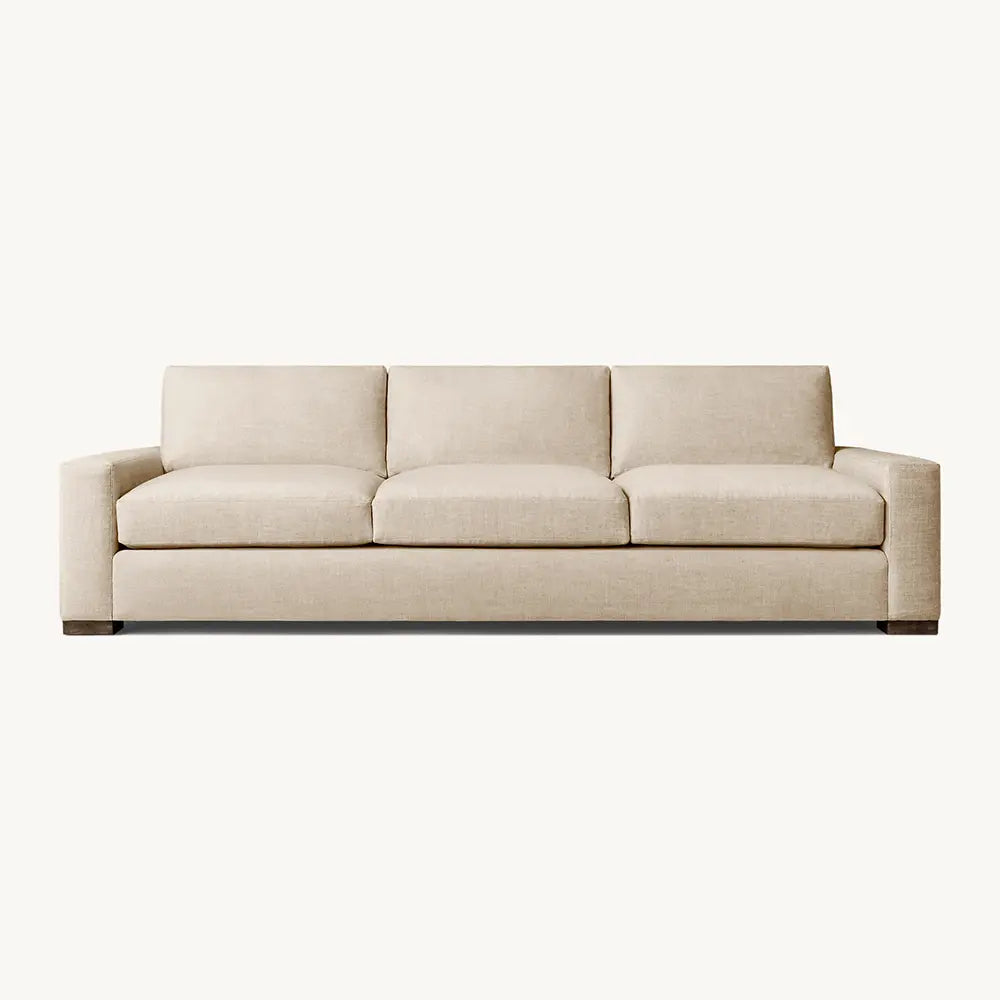 Adison sofa with luxury upholstery in living room setting.