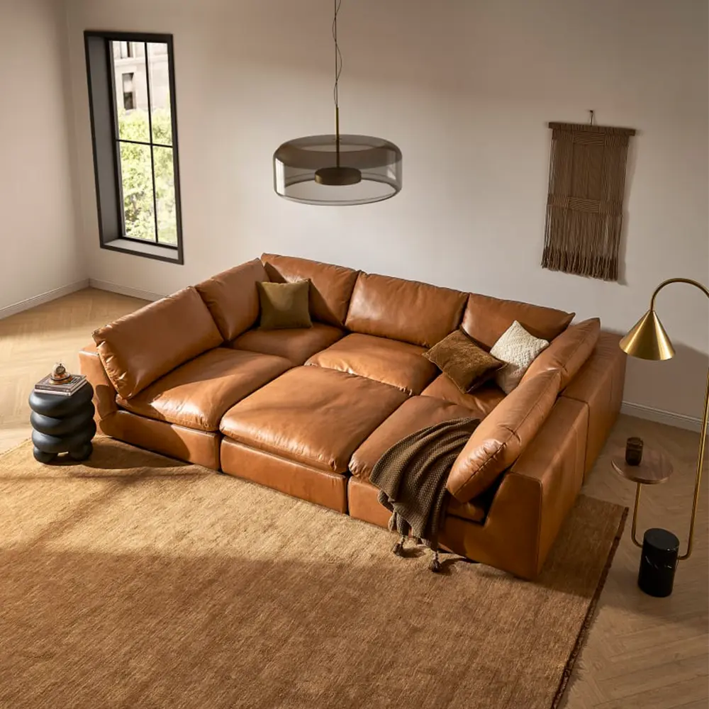 Brown leather sectional sofa in a living room with decor elements.