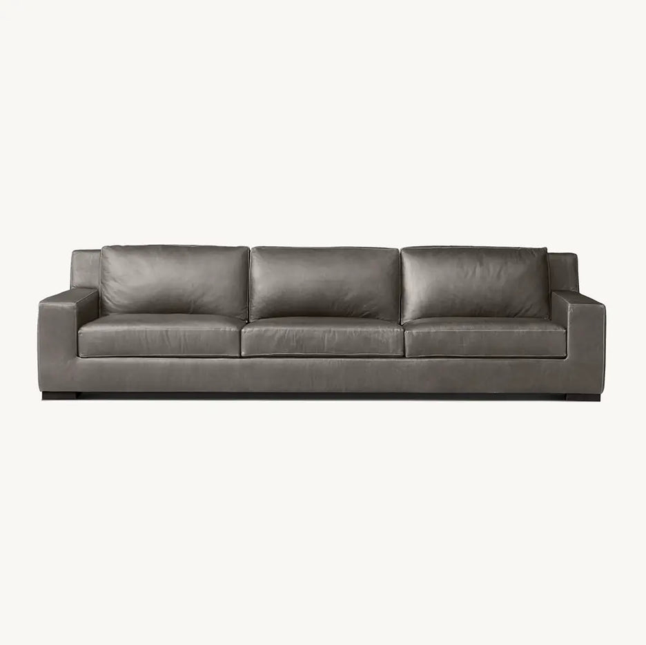 Gray leather sofa with stylish finish in living room.
