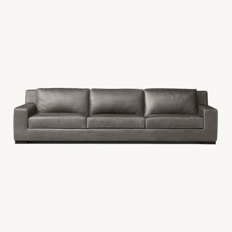 Gray leather sofa with stylish finish in living room.