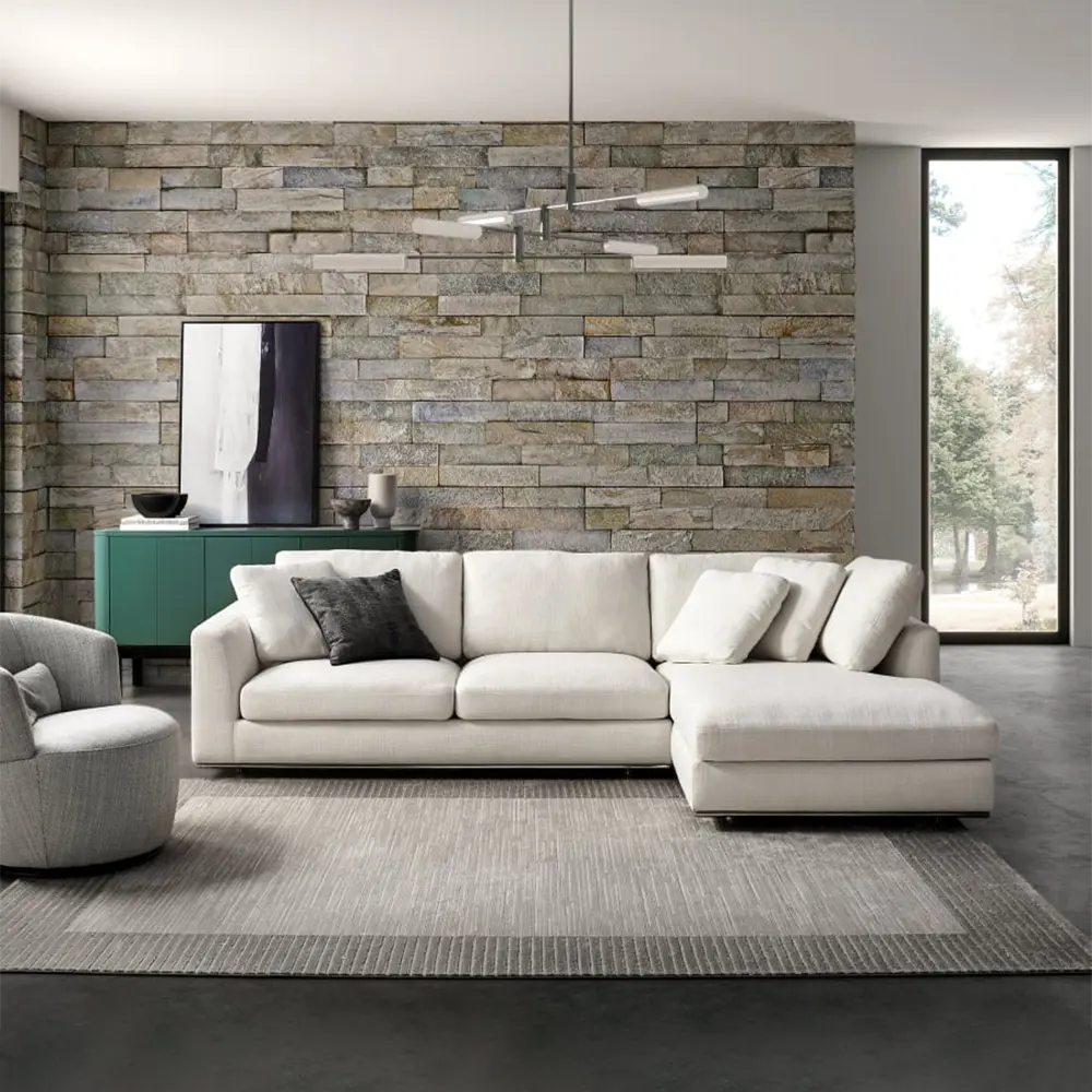 Modern living room with a white sofa, gray armchair, and ottoman.