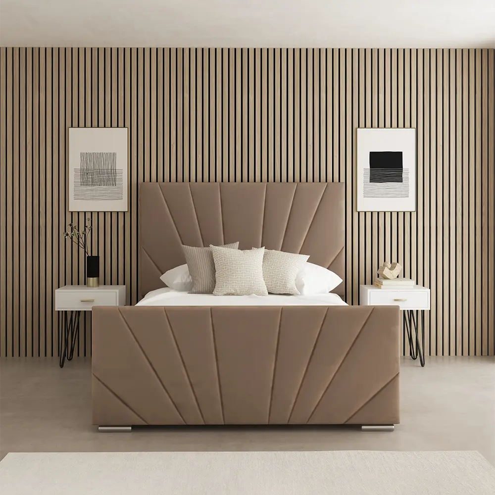 Beige upholstered bed in a room with striped walls and side tables.