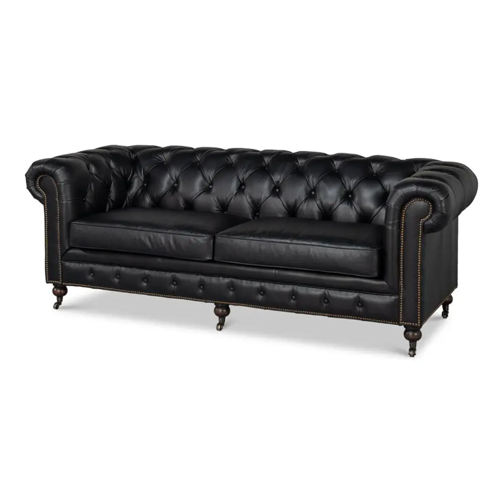 Stylish Black leather sofa with tufted backrest on a white background