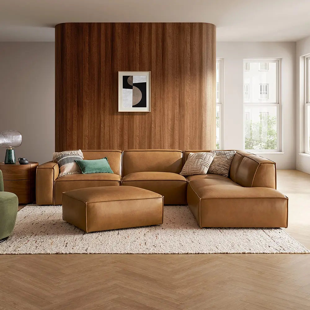Brown sectional sofa in a modern living room with sturdy frame.