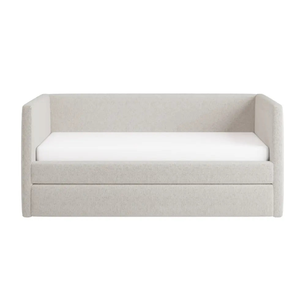 Light gray upholstered sofa bed with white mattress on a white background