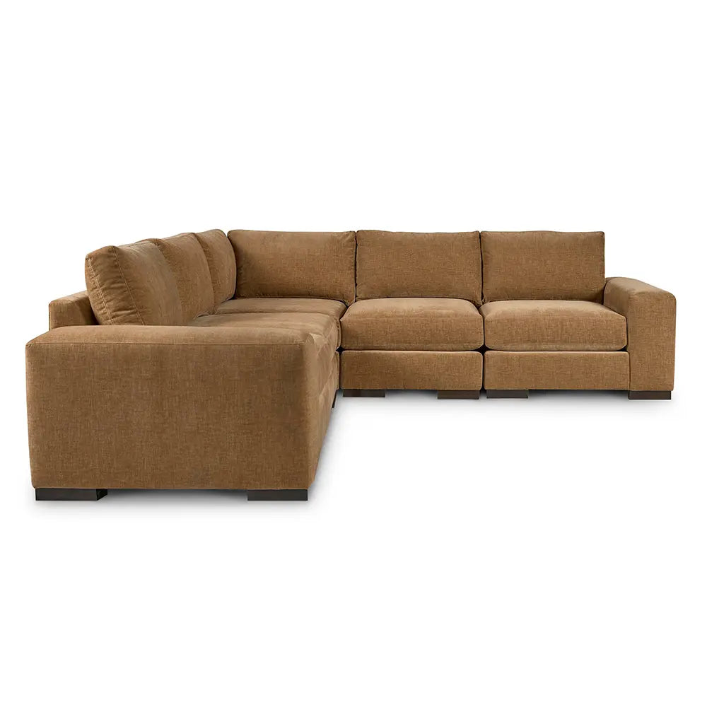 Brown sectional sofa with sleek profile in sitting space.