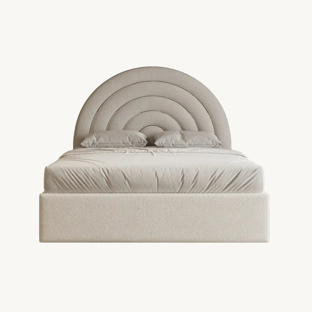 Beige upholstered bed with round headboard on a white background