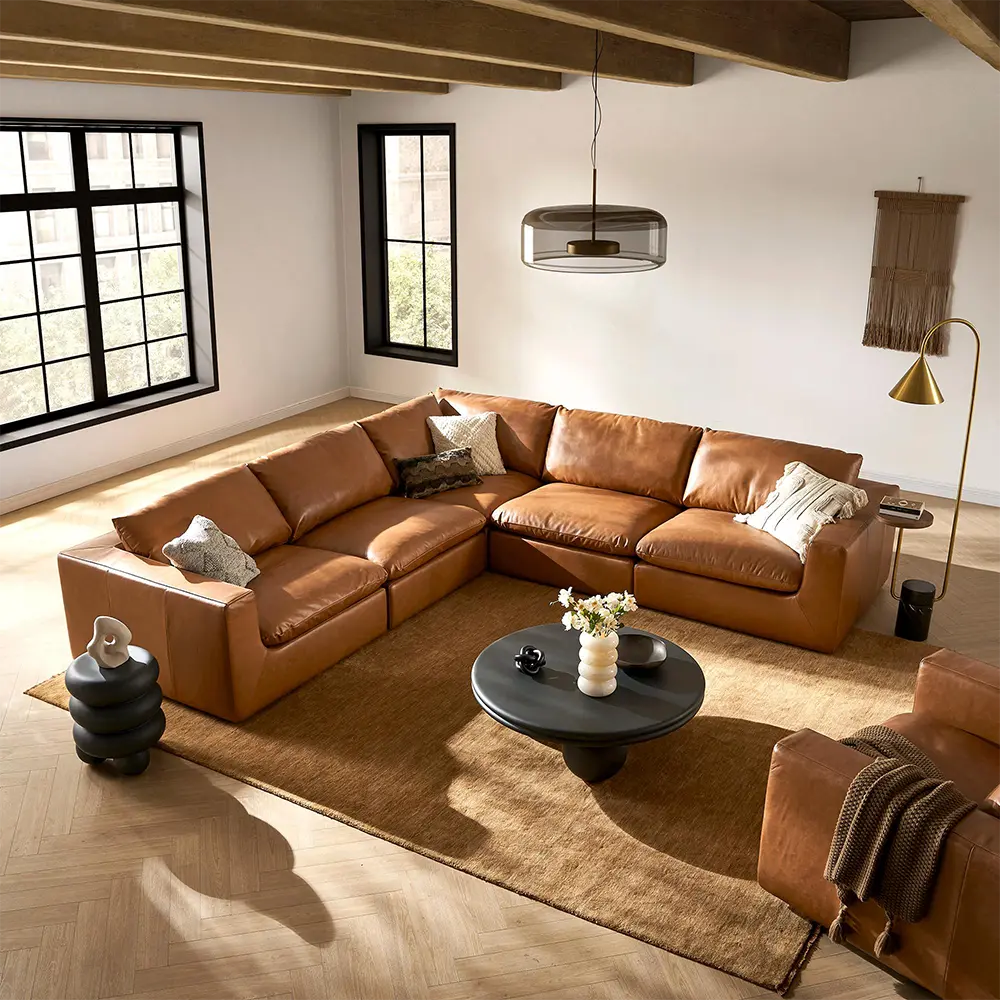 Modern living room with a brown leather sectional sofa and coffee table.
