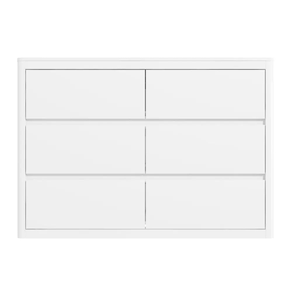White cabinet with multiple drawers on a white background
