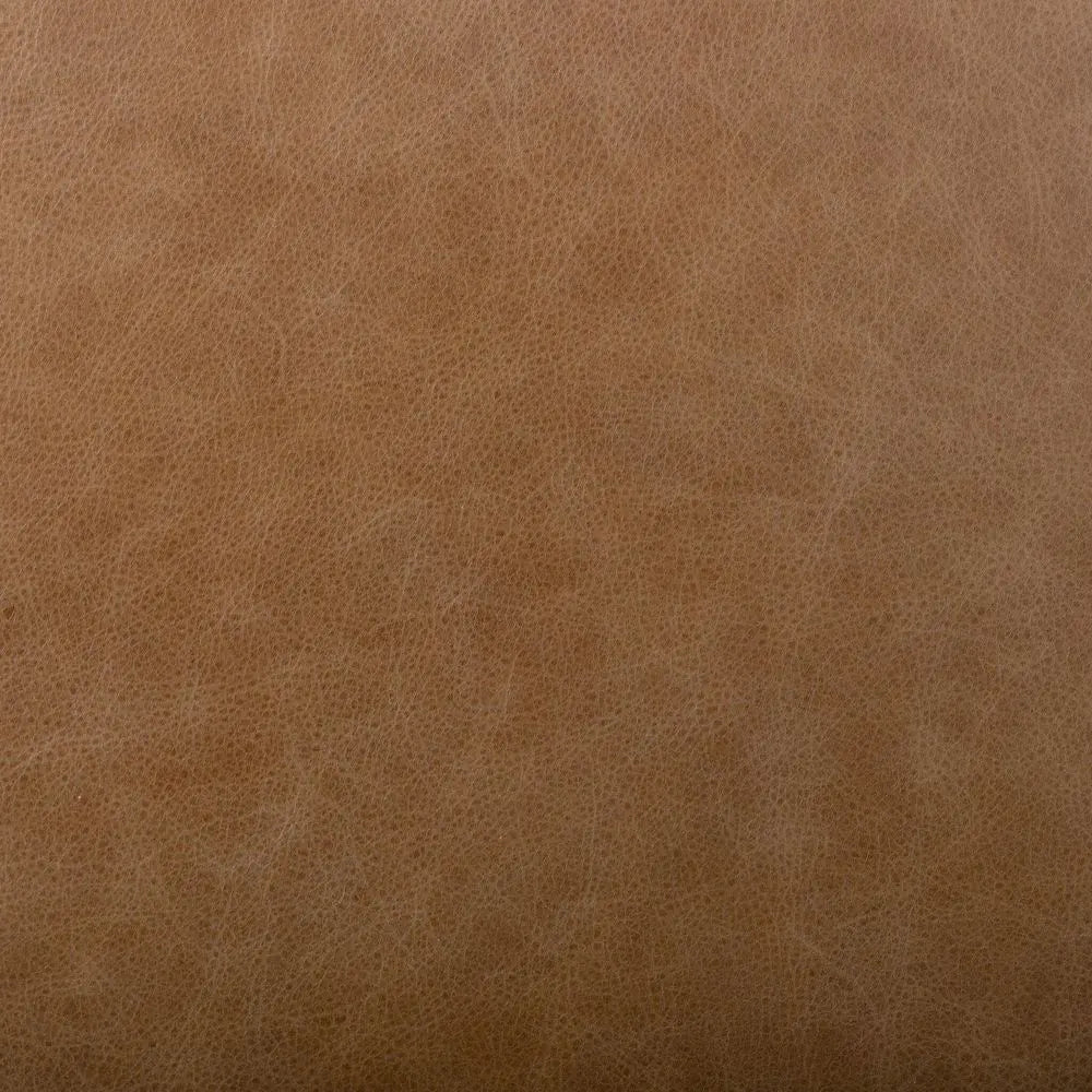 Close-up of brown leather texture of chair.