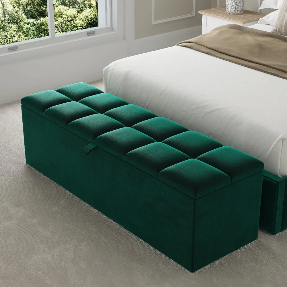 Green tufted ottoman in a bedroom setting with a bed enhances sophistication.