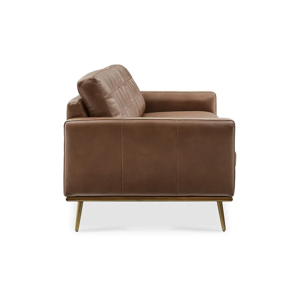 Brown leather sectional sofa in modern sitting space.