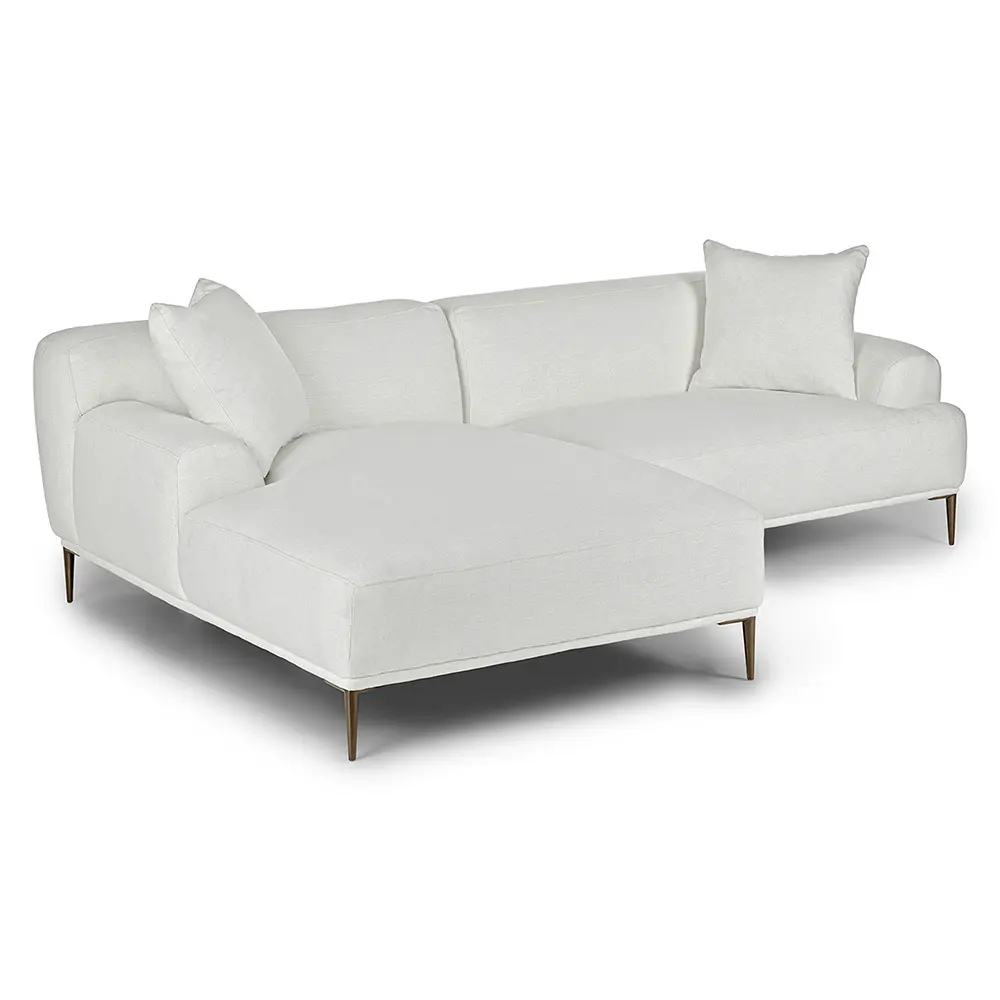 White sectional sofa with cushions on a white background