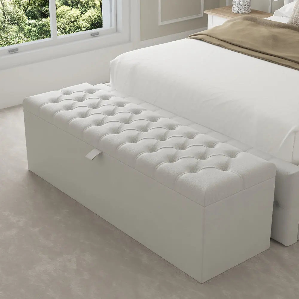 White tufted ottoman in bedroom creates a cohesive interior look.
