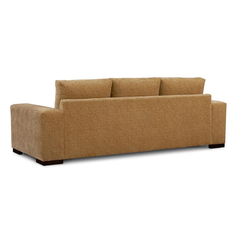 Brown sofa backside with sturdy frame in living room setting.