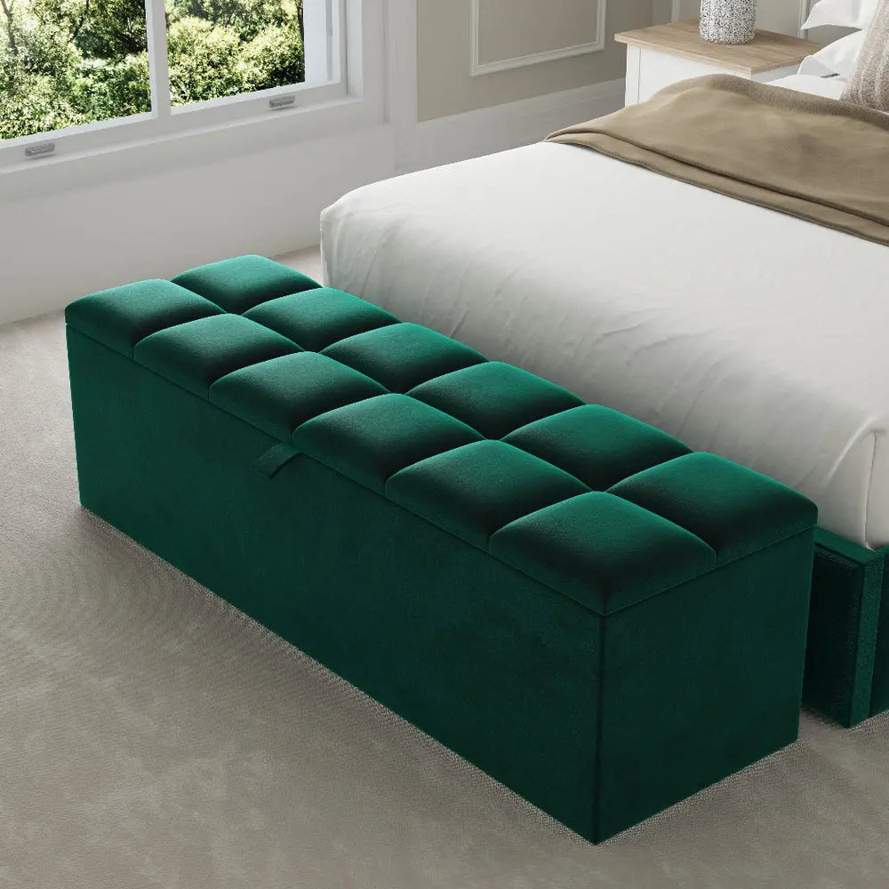 Green tufted ottoman in a bedroom setting with a bed redefine bedroom into signature grace.
