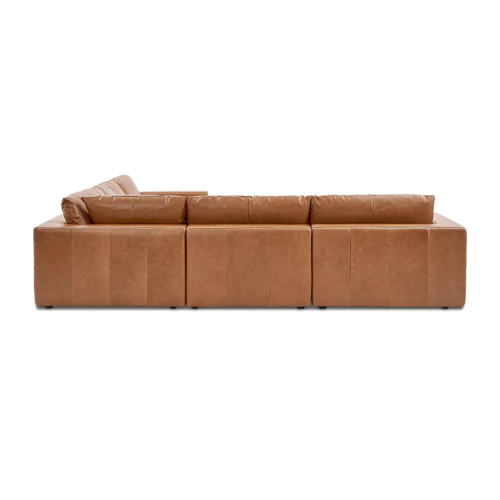Brown leather sectional sofa with stylish finish in modern lounge setting.