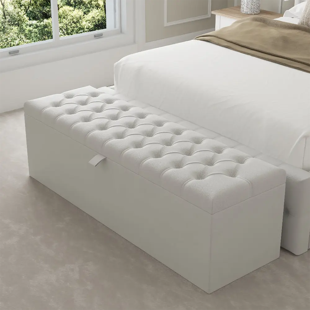 White tufted ottoman in bedroom enhances overall decor