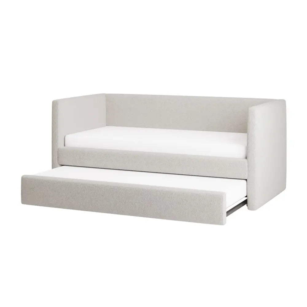 White upholstered sofa bed with a pull-out trundle on a white background