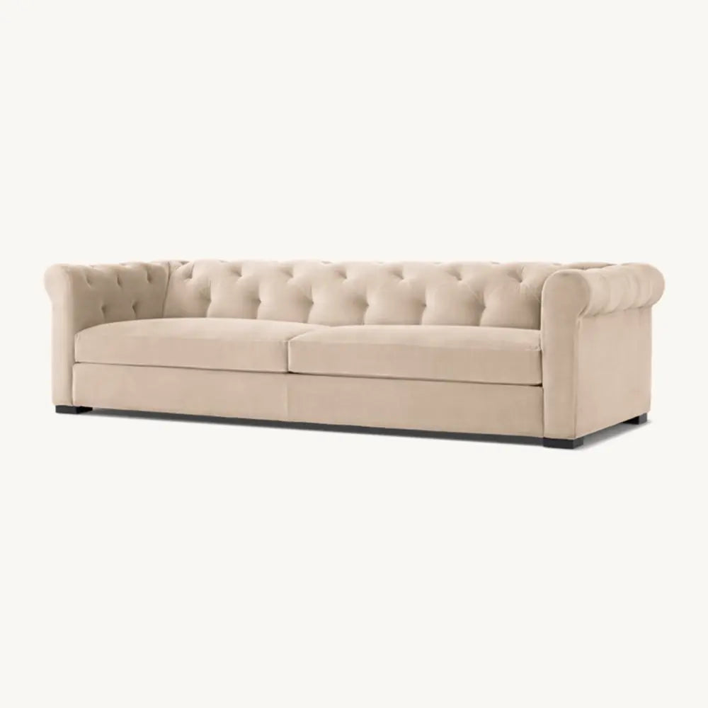 Beige sofa with sturdy frame in sitting space.