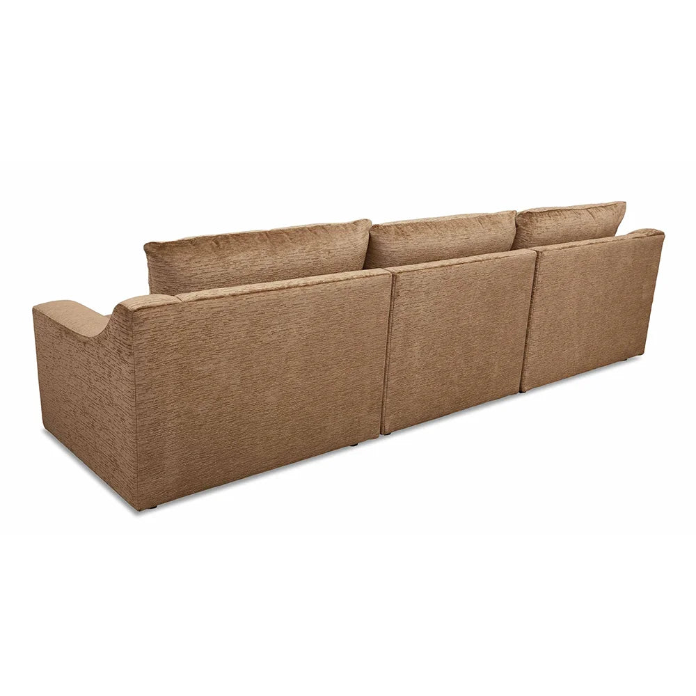 Brown sectional sofa with sleek profile in sitting space.