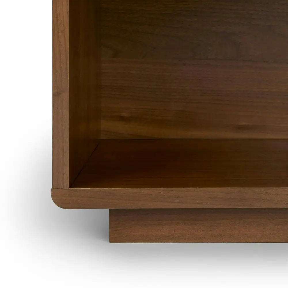 Close-up of a wooden shelf corner of bedside table.