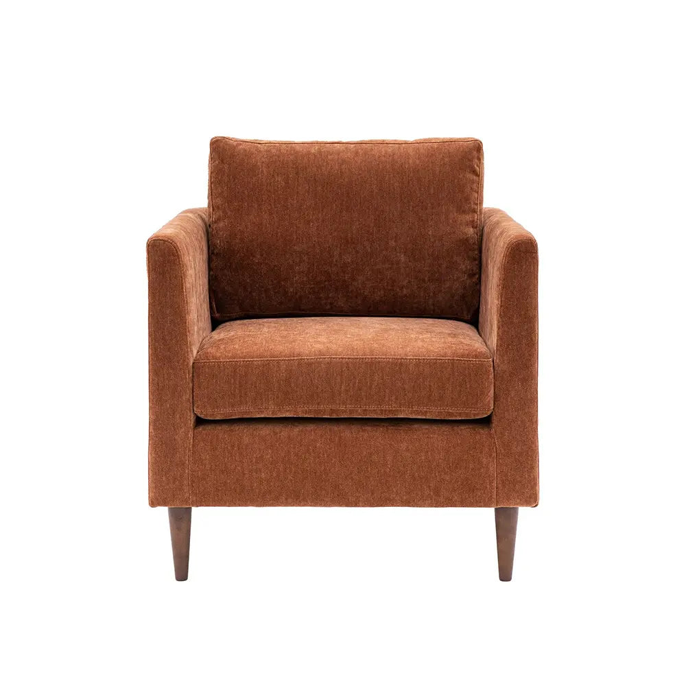 Brown armchair with premium fabric in living room setting.