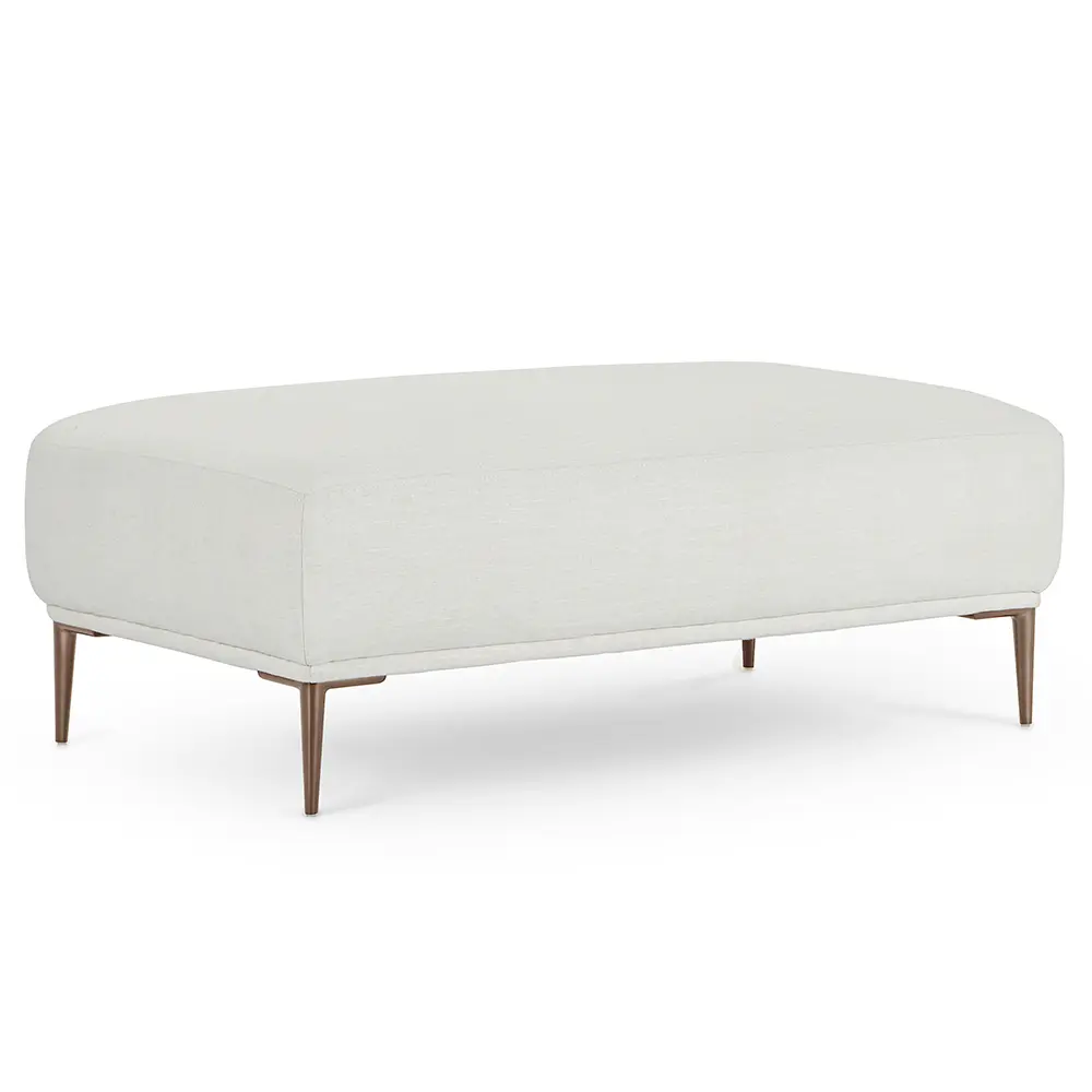 White upholstered ottoman with wooden legs in modern lounge.