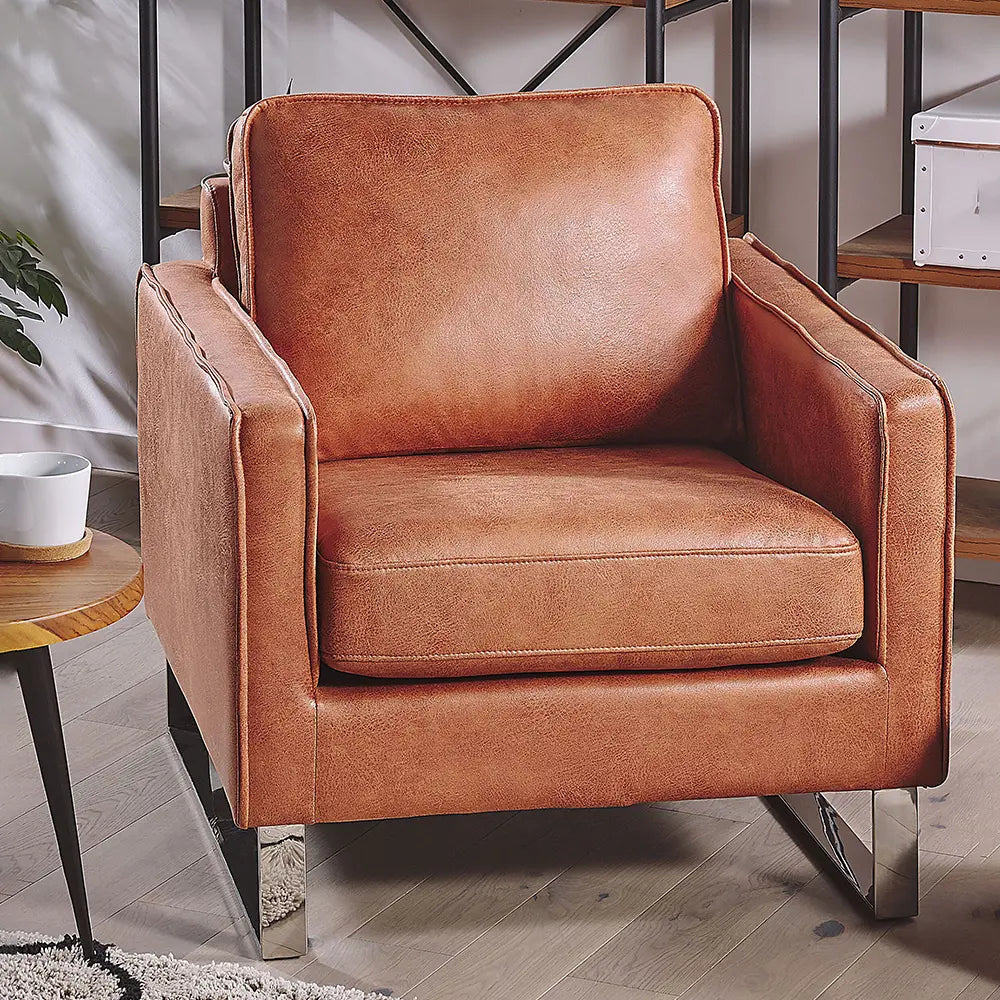 Brown leather armchair in a room with cozy style.