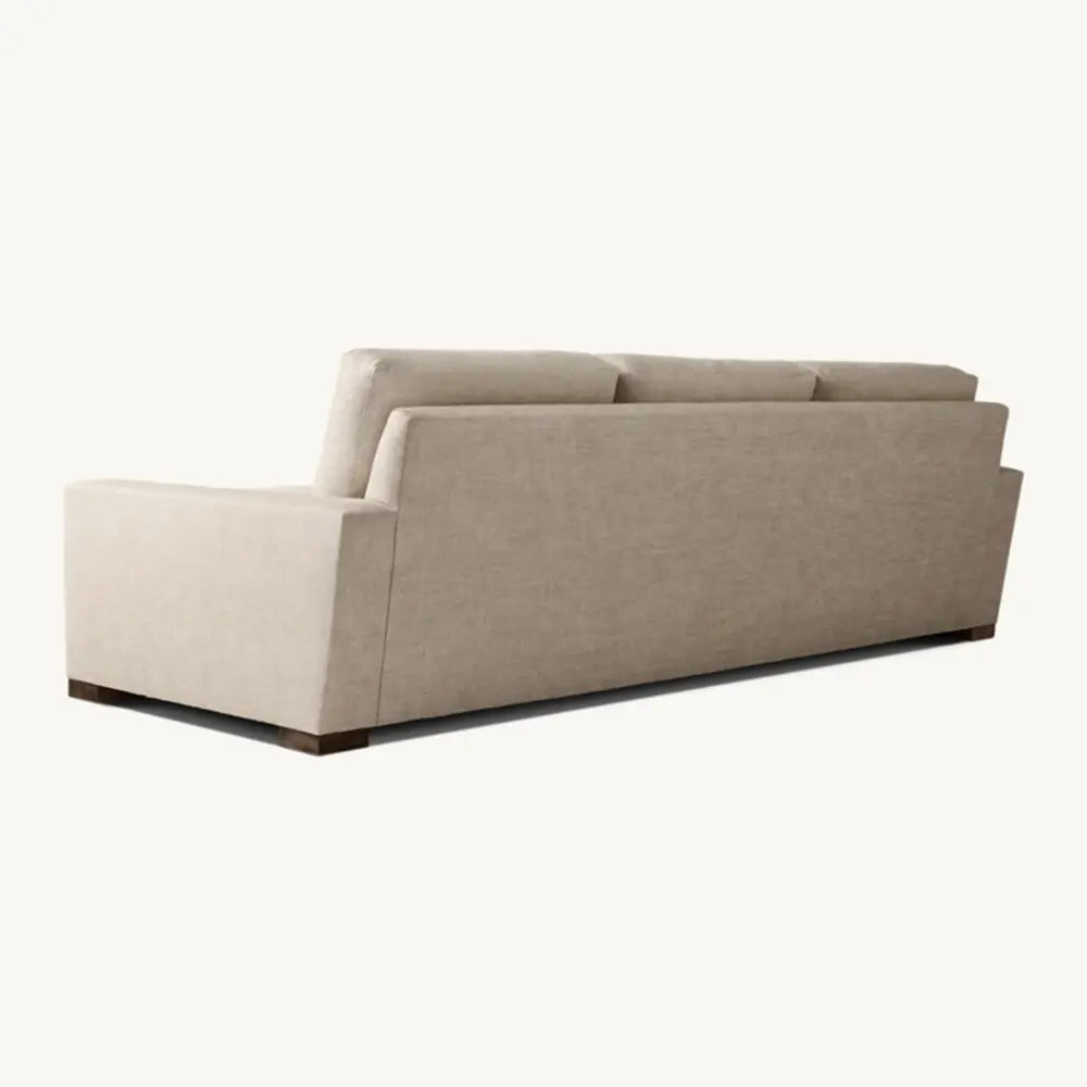 Adison sofa with sleek profile in living space setting.