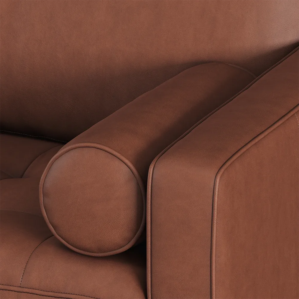 Close-up of a brown leather sofa with a focus on texture and color.