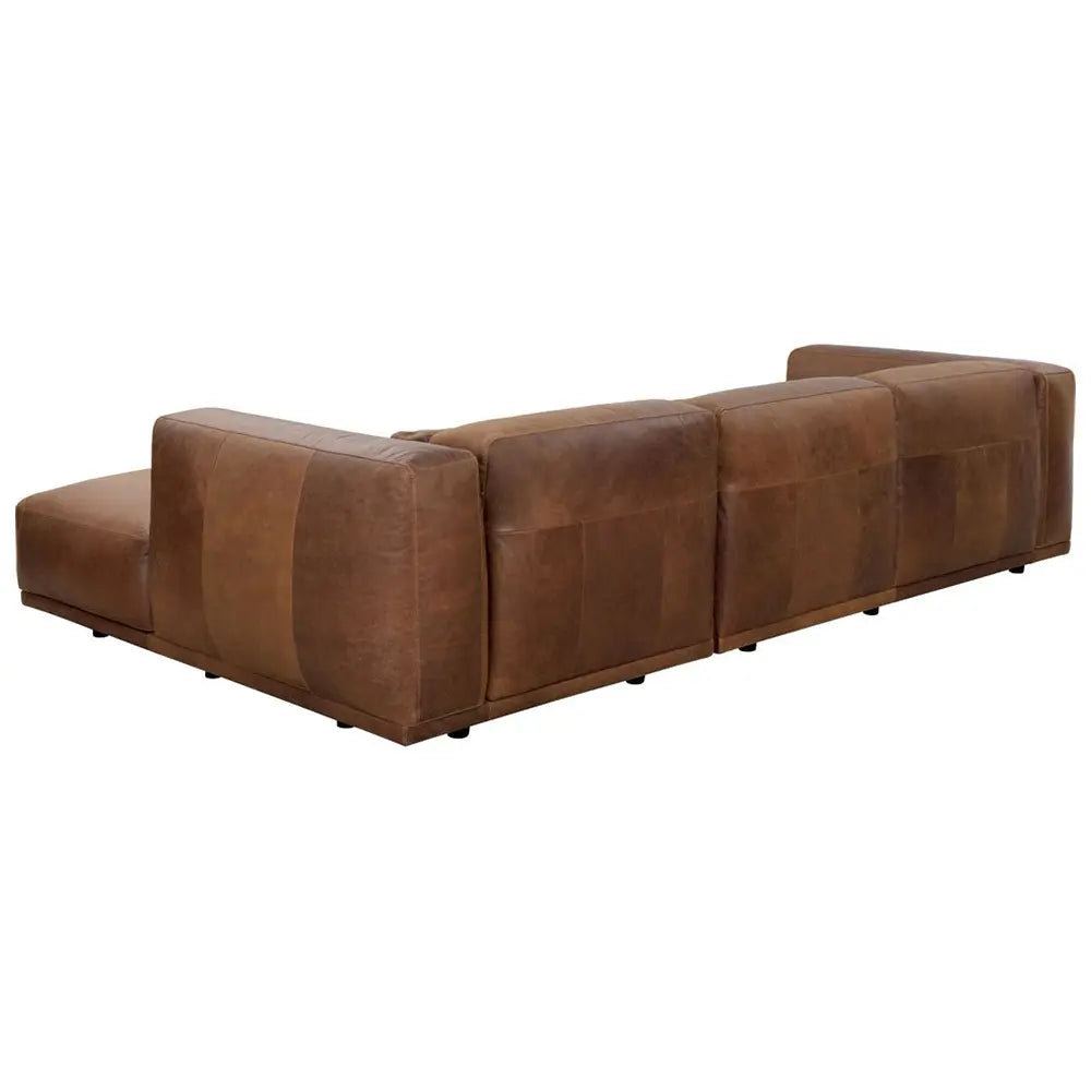 Brown leather sectional sofa in lounge.