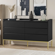 Black dresser with gold legs in a room setting