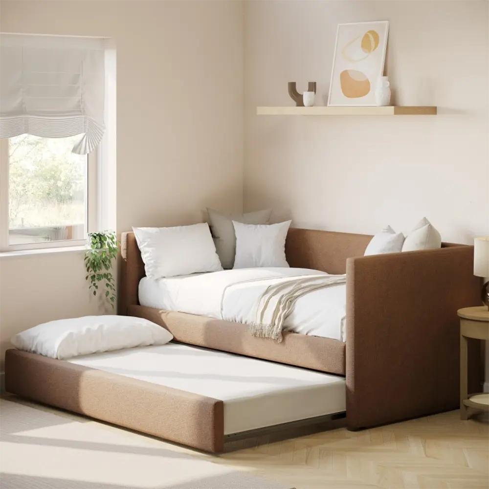 Beige bed with pull-out trundle in a modern bedroom.