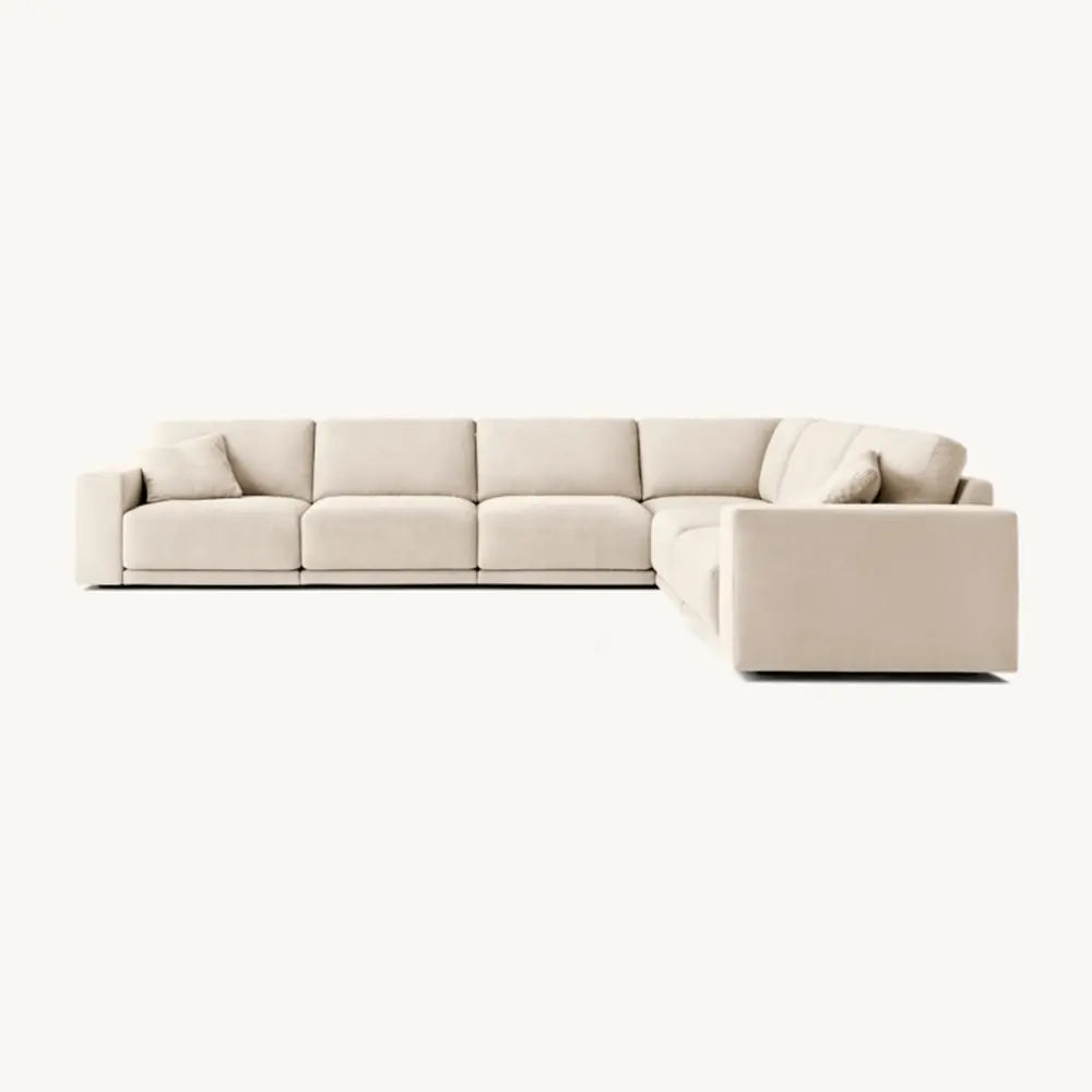 Beige sectional sofa with premium fabric in living room setting.