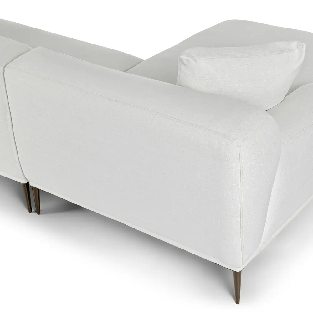White sofa with soft pillow and wooden legs on a white background