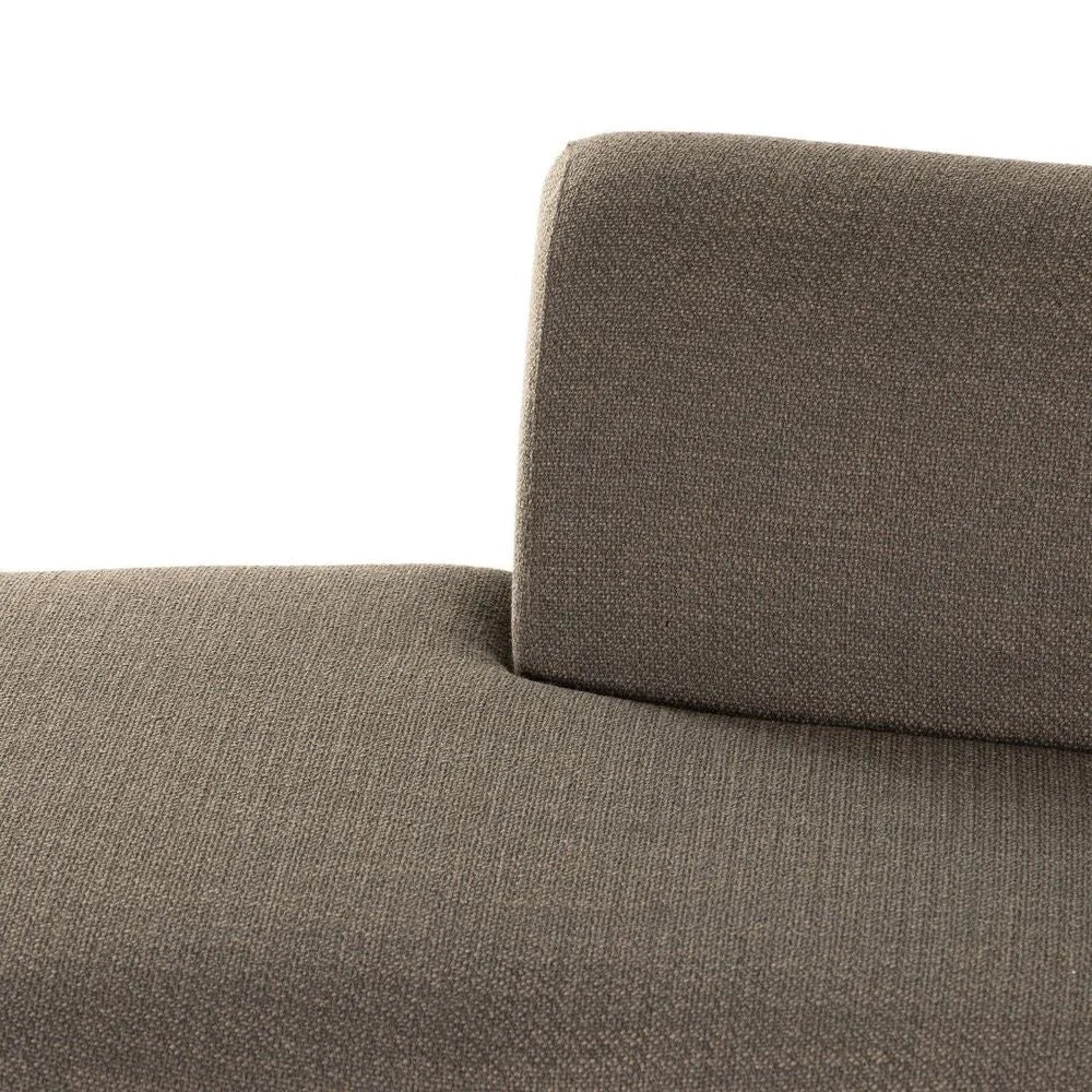 Close-up of a brown textured sofa with a white background