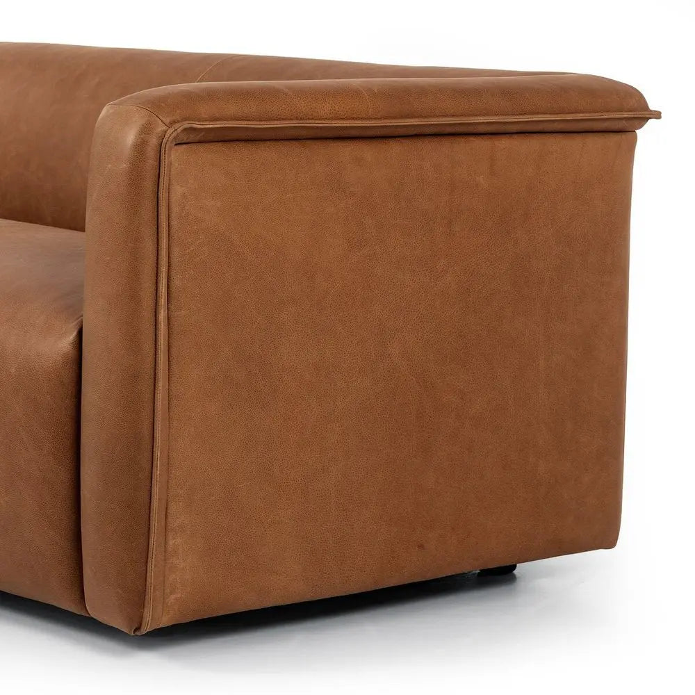 Brown leather sofa corner close-up on a white background