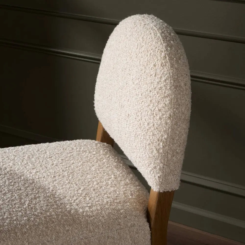 Chair with textured beige backrest and seat in living room.