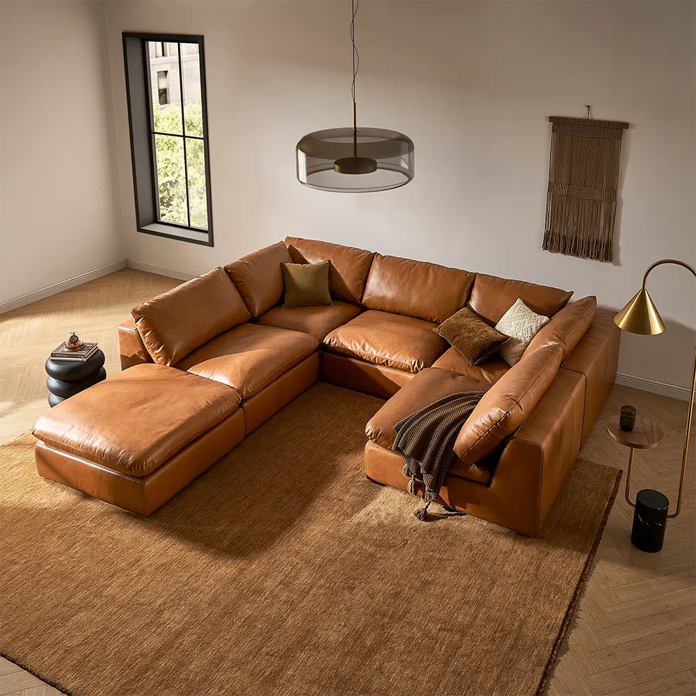 Brown leather sectional sofa in a modern living room.