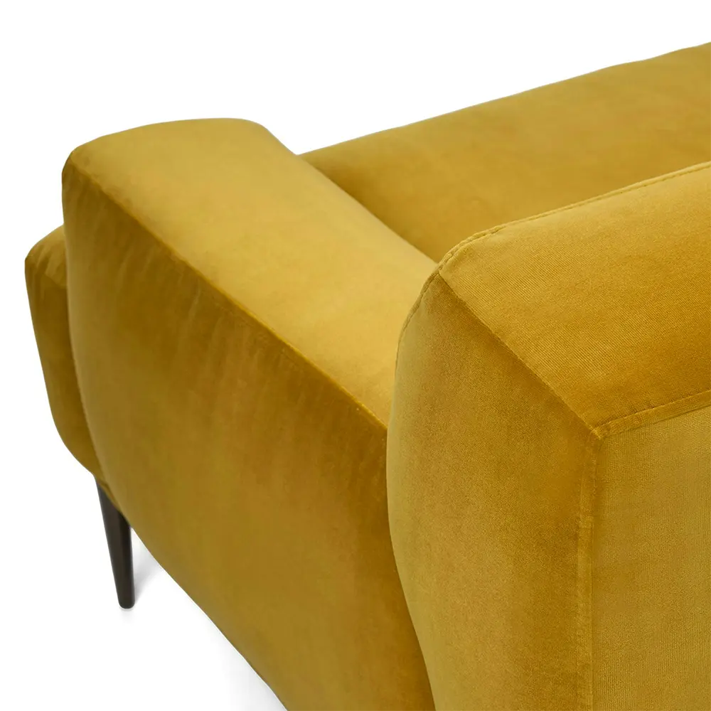 Mustard yellow armchair with soft texture in living room.