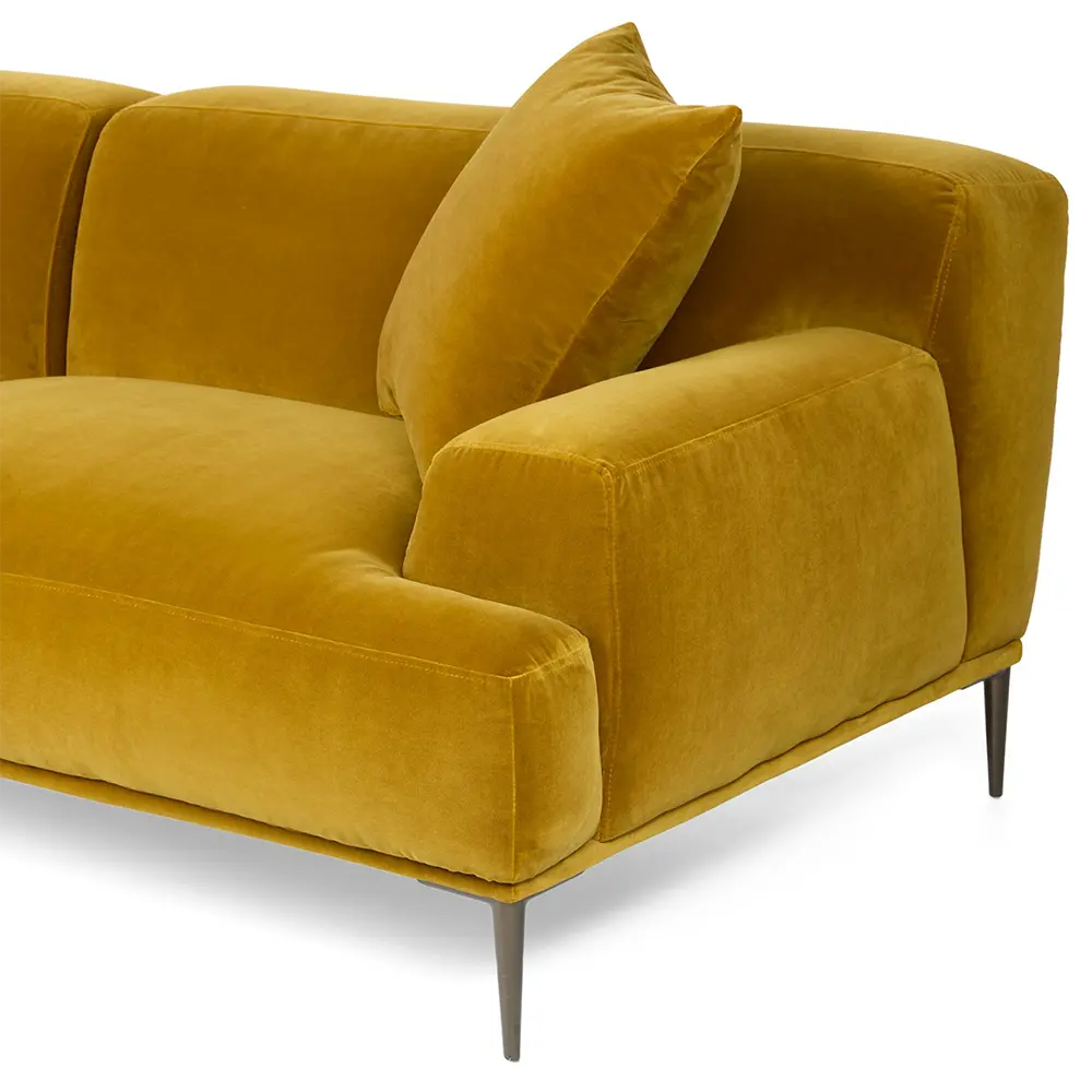 Stylish mustard yellow sofa with a pillow on a white background