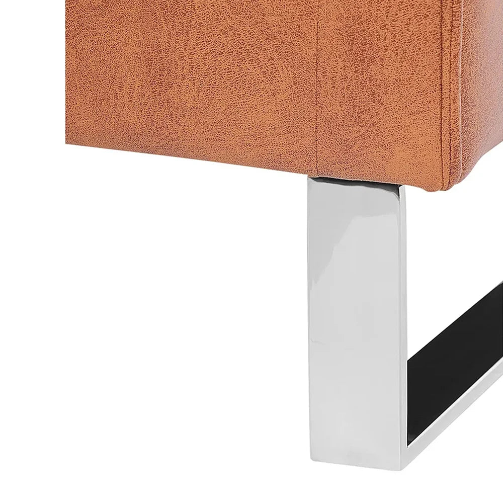 Close-up of a white stylish metal leg of armchair.