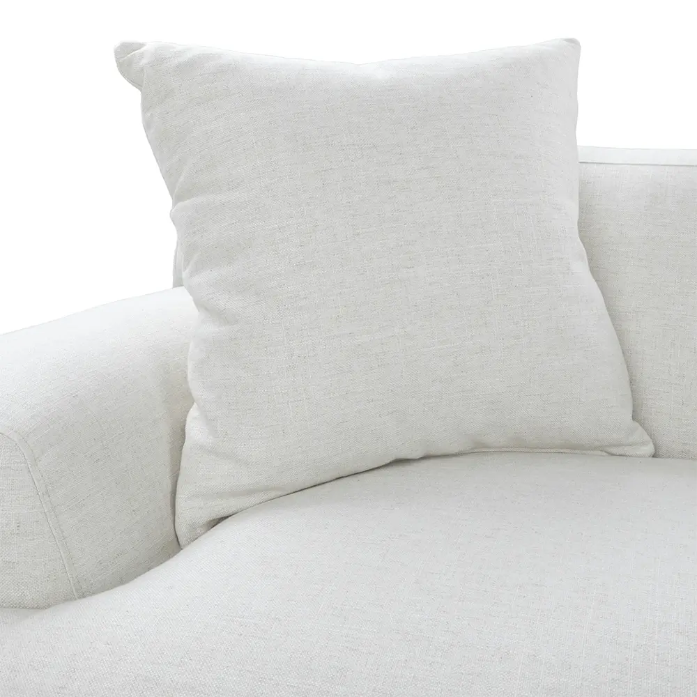 Light gray pillow on a light gray sectional sofa