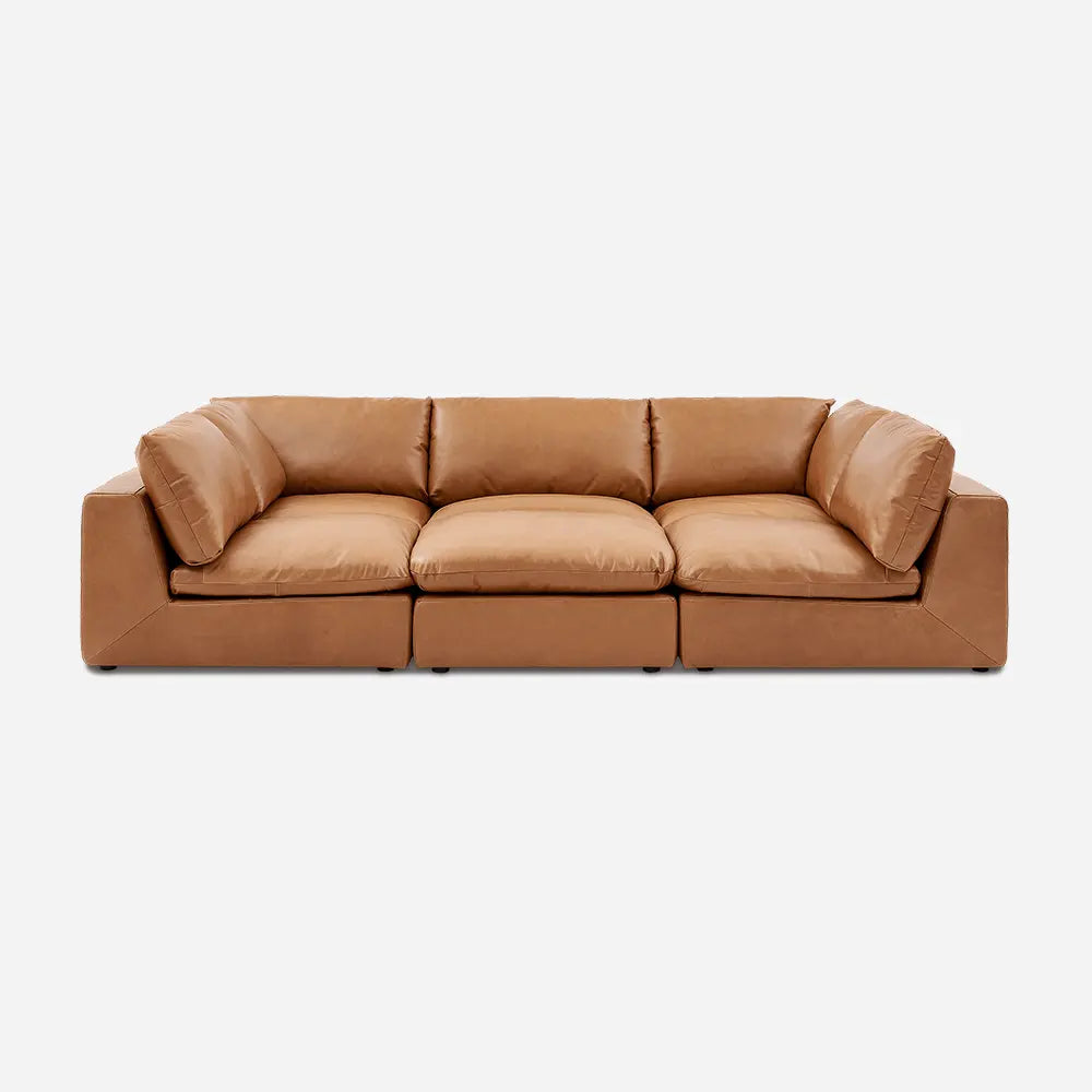 Brown leather sofa with stylish finish in modern living room.